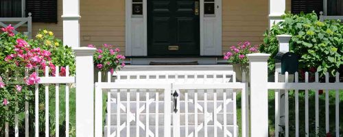 home-with-white-picket-fence-and-gate